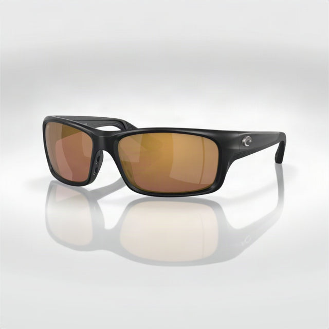 Black sunglasses with brown lenses on a white background